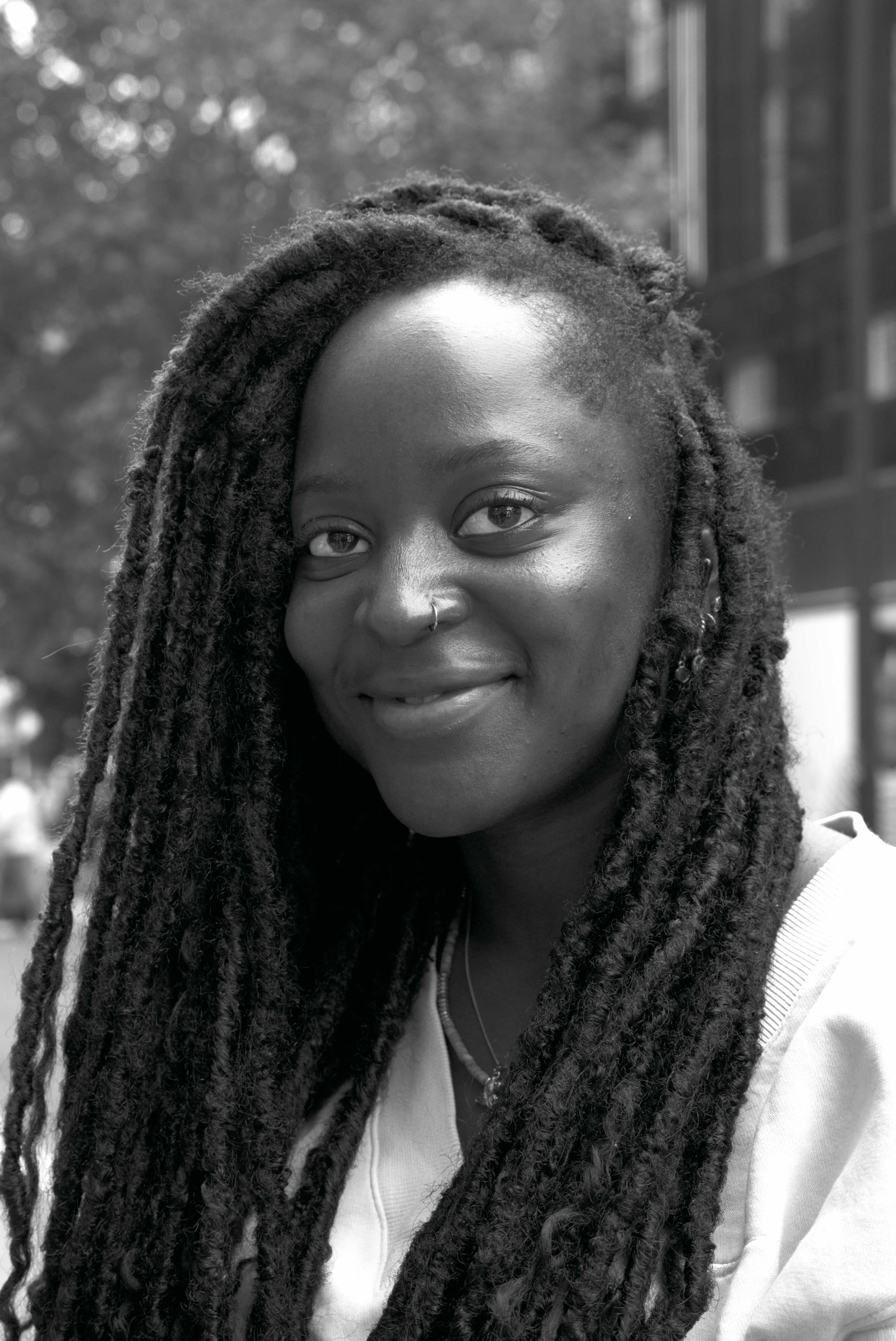 Portrait: Soulful Smile - A moment of grace and quiet confidence found in the heart of the city.